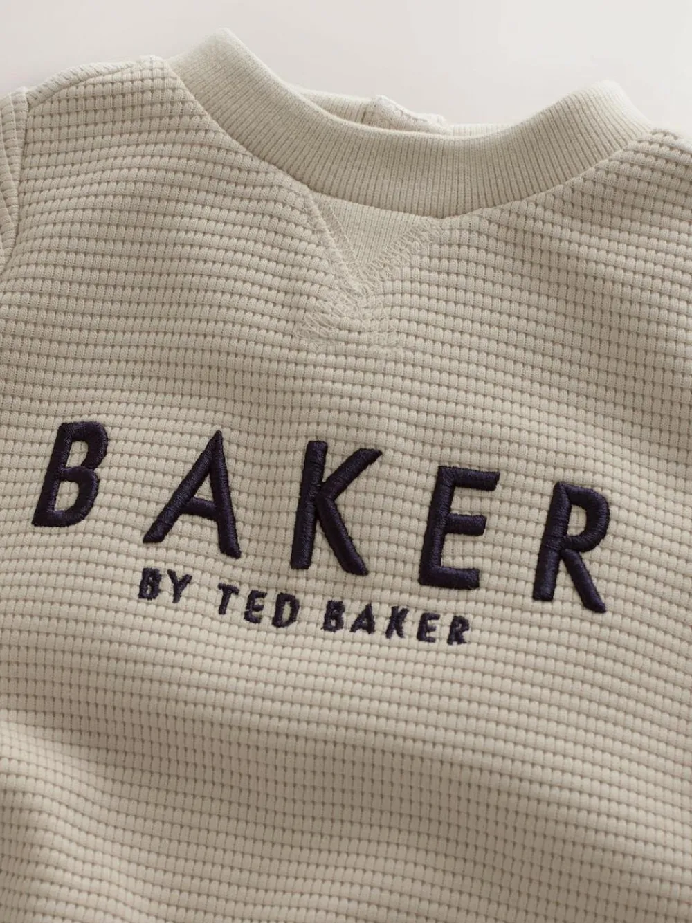 Baker by Ted Baker Textured Long Sleeve Romper^ Rompers & Overalls